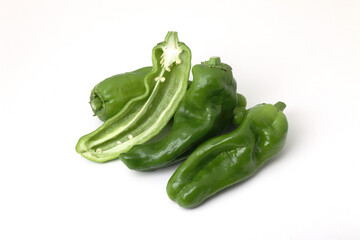 green sweet long peppers isolated on white background.