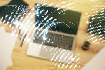 Double exposure of abstract digital world map with connections on laptop background, research and strategy concept