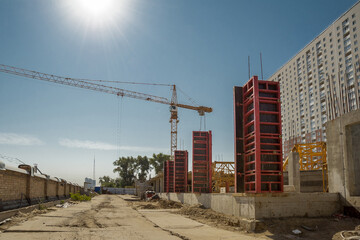 Column formwork and crane on house construction.