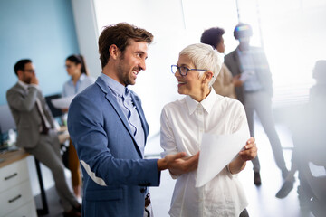 Group of multiethnic successful business people working and communicating at the office