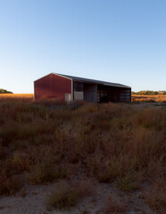 old red barn in the field