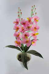 closeup Indonesian home made imitation pink flower made from papper and plastic, diy craft