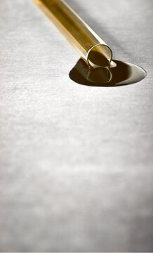 Oil pool on a white paper from a test tube 