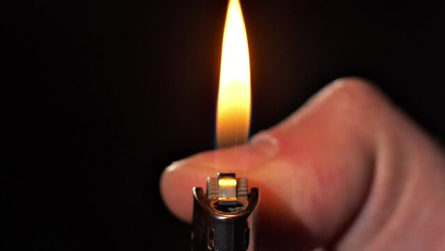 Close-up in slow motion of a light spark with a black background