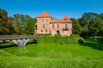 Fototapeta na wymiar Oporowski Castle build in the Gothic style in the years 1434 - 1449. Oporow, Lodz Voivodeship, Poland