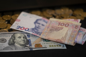 money, us dollars and ukrainian hryvnia