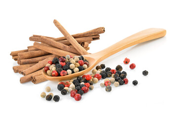 Mix from  kinds of pepper and  spoons isolated on white