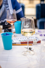 Glass with wine on the table among drawing accessories 