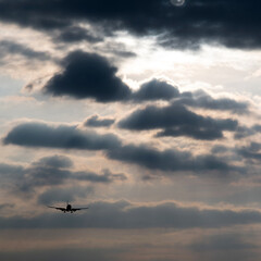 Airplane flying in overcast sky