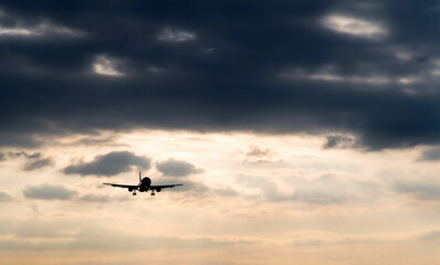 Airplane flying in overcast sky