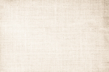 Jute hessian sackcloth canvas woven texture pattern background in light beige cream brown color blank empty.