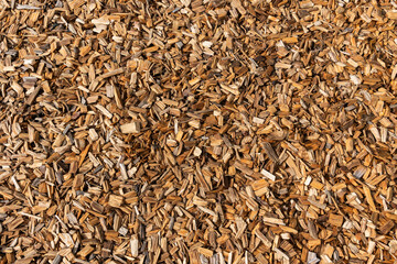 Wood chip bark chippings having been shredded for use as a garden mulch by the lumber timber industry which can be used as an abstract texture background, stock photo image