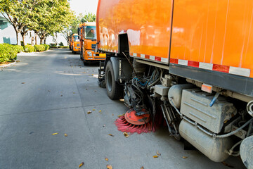 Street sweepers are cleaning city street