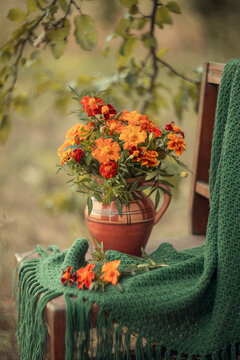 Still-life. Photo of a bouquet of marigolds in a vase.