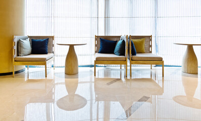 Empty chair and table on office lobby