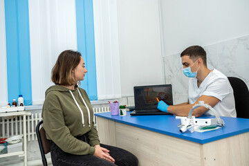 young female patient is sitting in the doctor's office, who has come for a consultation.