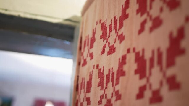 an authentic Ukrainian house
an embroidered towel hangs on the wall
Ukrainian national symbols