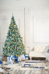 The guest room is decorated for Christmas, a tree with gifts and toys, Christmas balls