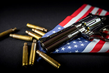 black revolver ammunition on folded united states flag is against constitution of united states