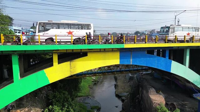 Busy Morning Traffic Travels Across Bridge in Malang, Indonesia
