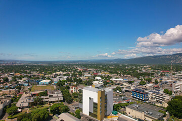 Aerial view of Kingston city, Jamaica. City landscape, roads, buildings, mountains