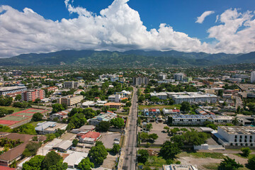Aerial view of Kingston city, Jamaica. City landscape, roads, buildings, mountains - obrazy, fototapety, plakaty