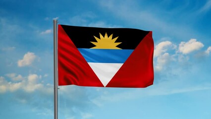 Antigua and Barbuda flag  waving in the wind cycle looped video, with blue sky 