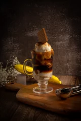 Fotobehang Vertical shot of a delicious ice cream dessert with a cookie on top of it © Romeo Sigue Jr/Wirestock Creators