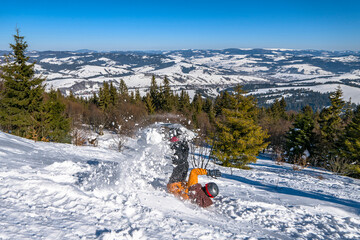 Snowboarder fallen down after jumping from snow hill. Mountain freeride snowboarding. Winter mountains