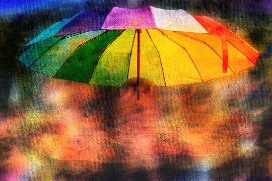 Schirm in Regenbogenfarben auf abstraktem Hintergrund 