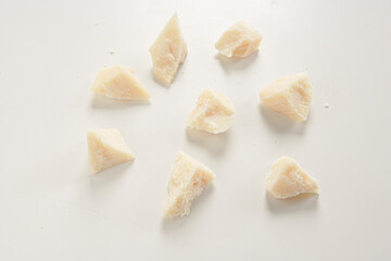pieces of parmesan on white