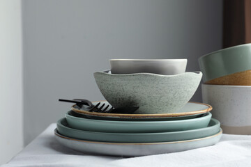 Stylish empty dishware and cutlery on table indoors