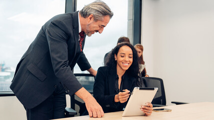 Successful business team working together in a co-working office	