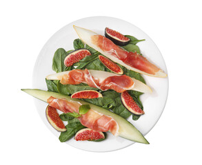Plate with tasty melon, jamon, figs and spinach isolated on white, top view