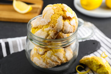 Delicious lemon cookies in glass jar on table, closeup