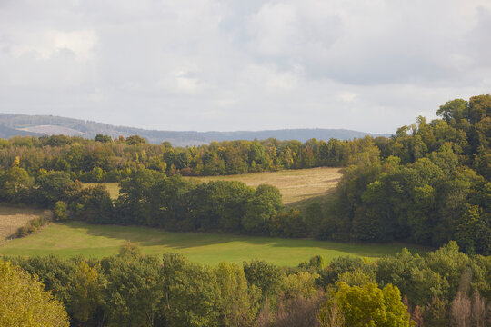 dry meadow with countryside hills in the background