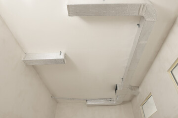 New ventilation system on beige ceiling indoors
