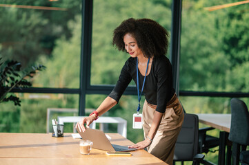 Businesswoman closing her lapop in the end of working day