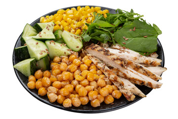 Chickpeas, corn, meat and chopped vegetables are laid out on a black round plate, on a white background, isolate