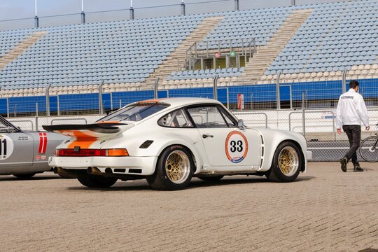 White sportscar in the TT Circuit Assen, the Netherlands