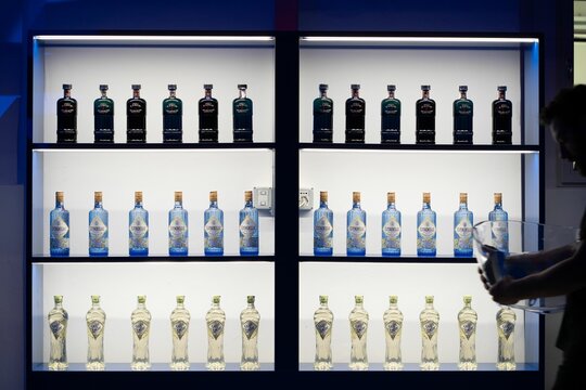 Illuminated Display With Expensive Bottles Of Alcohol At Milan Fashion Week