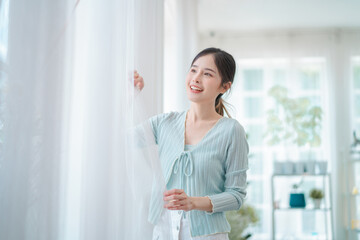 portrait of beautiful young asian woman, Closeup face of a pretty asian model looking at window.