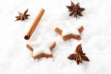 Chocolate nut star cookies christmas cookies in the snow.