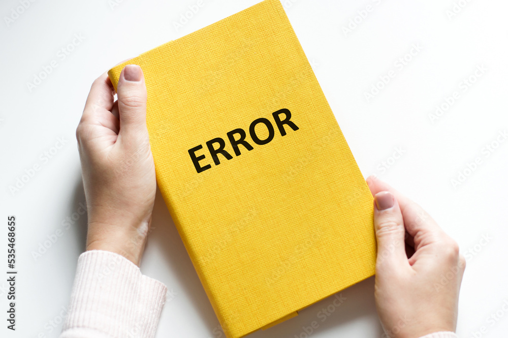Aufkleber man writes text on a card error on a light background