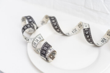 measuring tape in a white plate