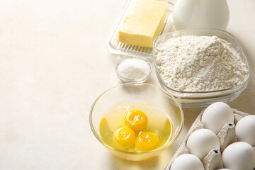 Different ingredients for baking on white table, closeup