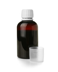Fototapeta premium Bottle of cough syrup and cup on white background