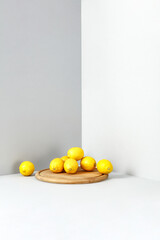 Fresh yellow lemon fruits and gray wall background. 