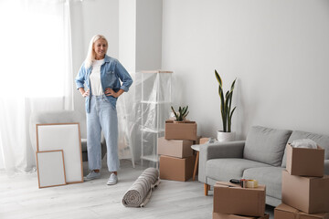 Mature woman in living room on moving day