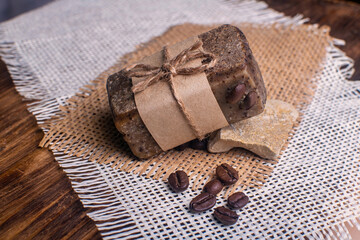 Bar of handmade soap with coffee beans. Spa concept for massage and relax.